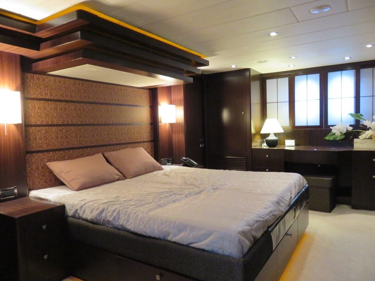 a large bed in a room aboard ANA Yacht for Sale