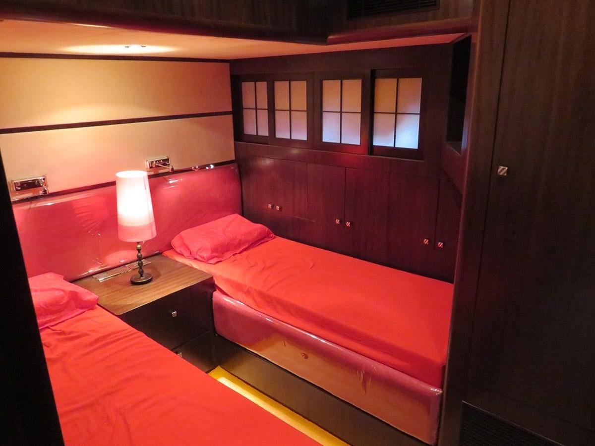a room with two beds aboard ANA Yacht for Sale