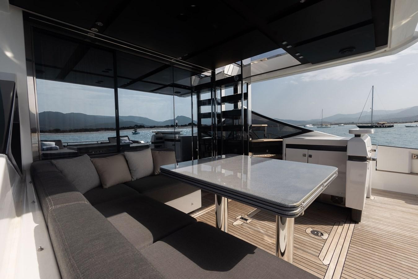 a room with a table and chairs aboard ESCAPE Yacht for Sale
