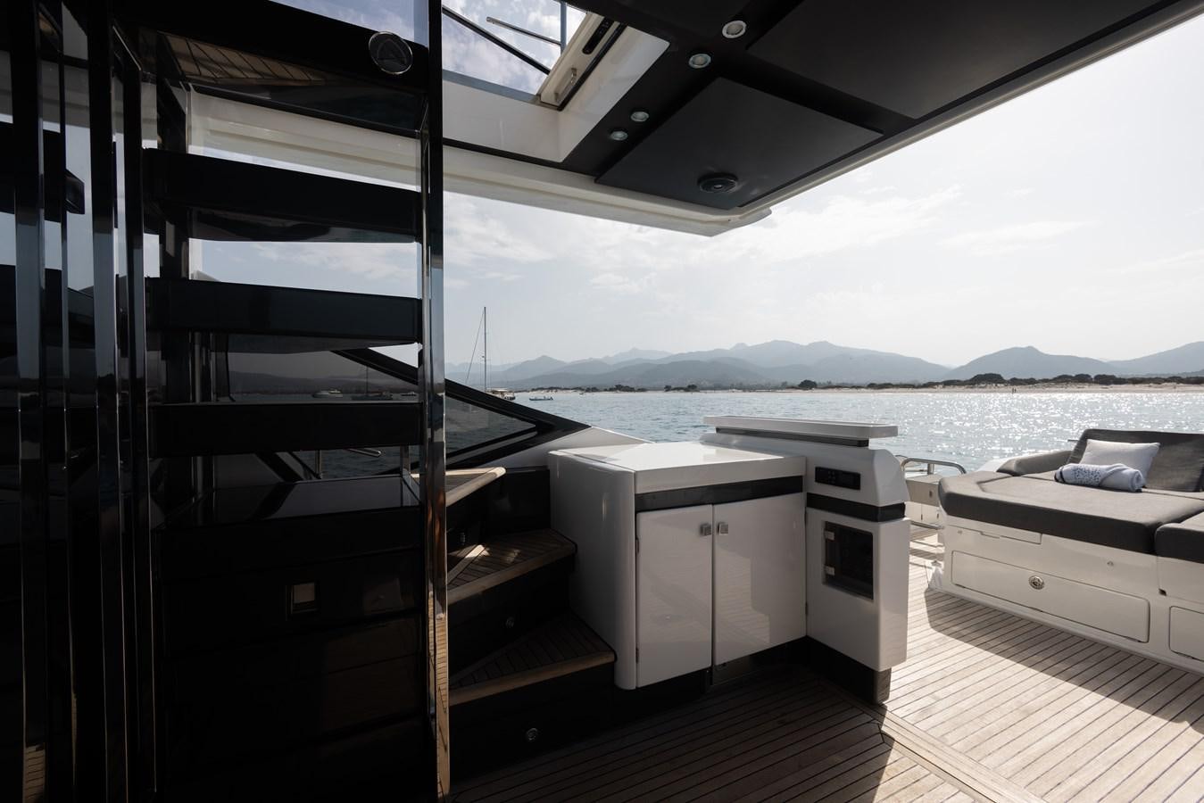 a boat dock with a large body of water and a large boat aboard ESCAPE Yacht for Sale