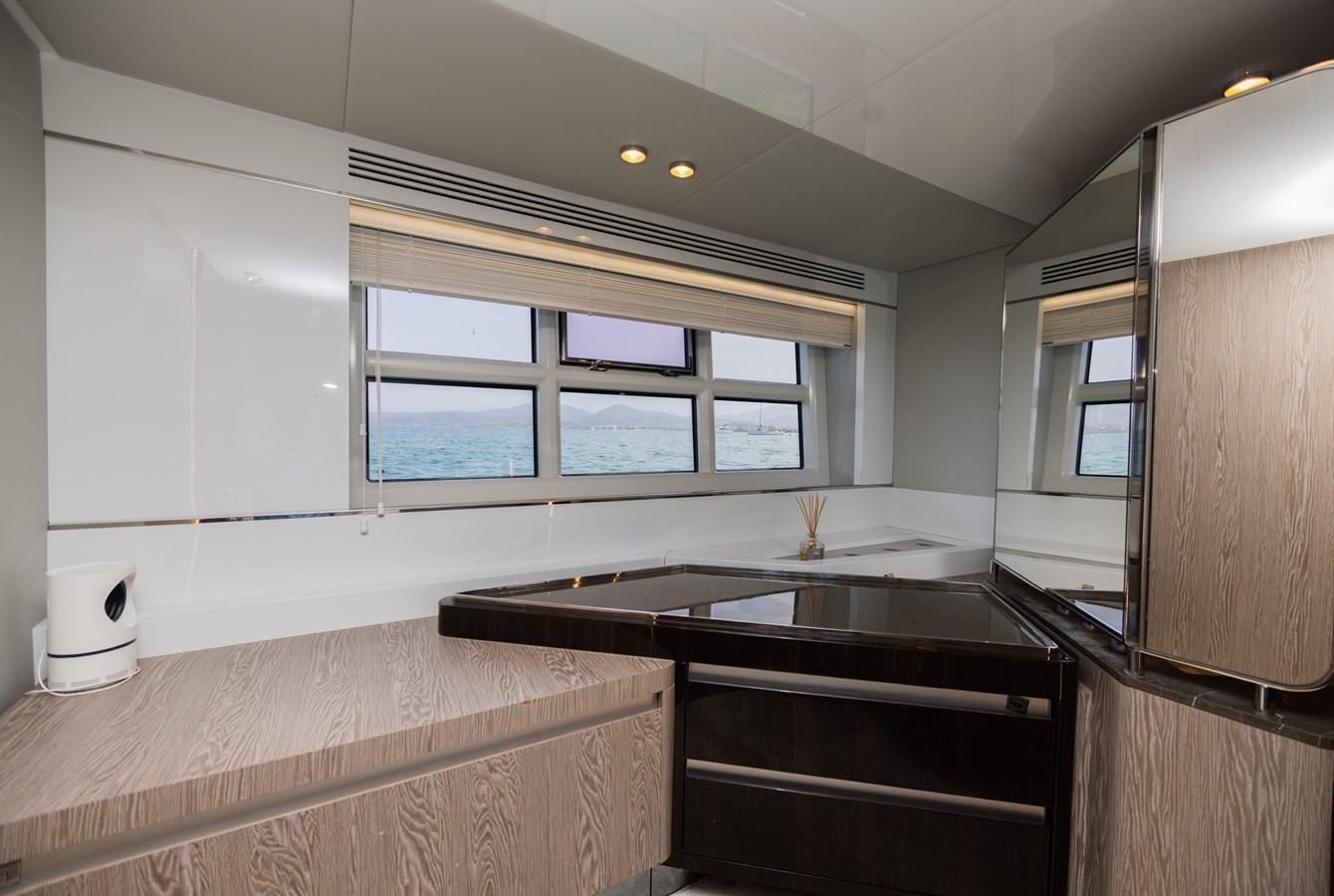a kitchen with a black counter top aboard ESCAPE Yacht for Sale