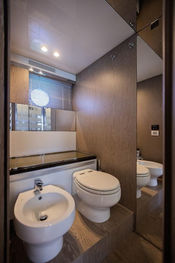 a bathroom with a sink toilet and a bathtub aboard ESCAPE Yacht for Sale