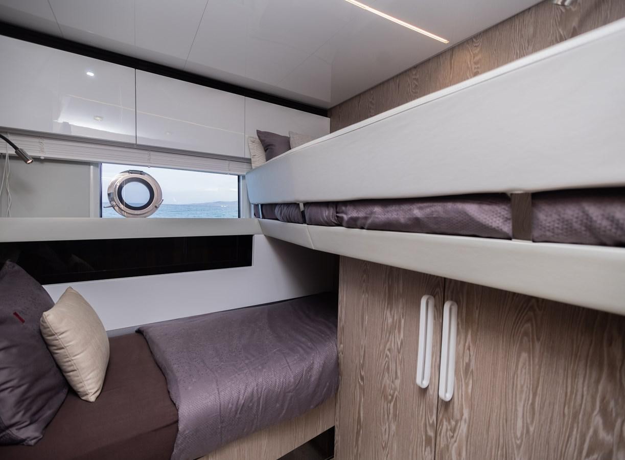 a room with a couch and a bed aboard ESCAPE Yacht for Sale