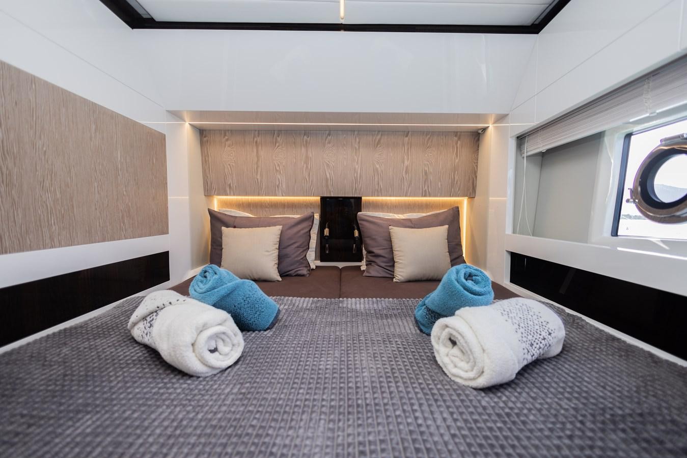 a couple of stuffed animals on a bed aboard ESCAPE Yacht for Sale