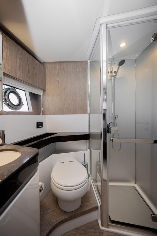 a bathroom with a toilet and sink aboard ESCAPE Yacht for Sale