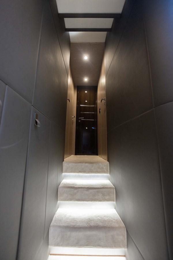 a hallway with a door and a carpet aboard ESCAPE Yacht for Sale