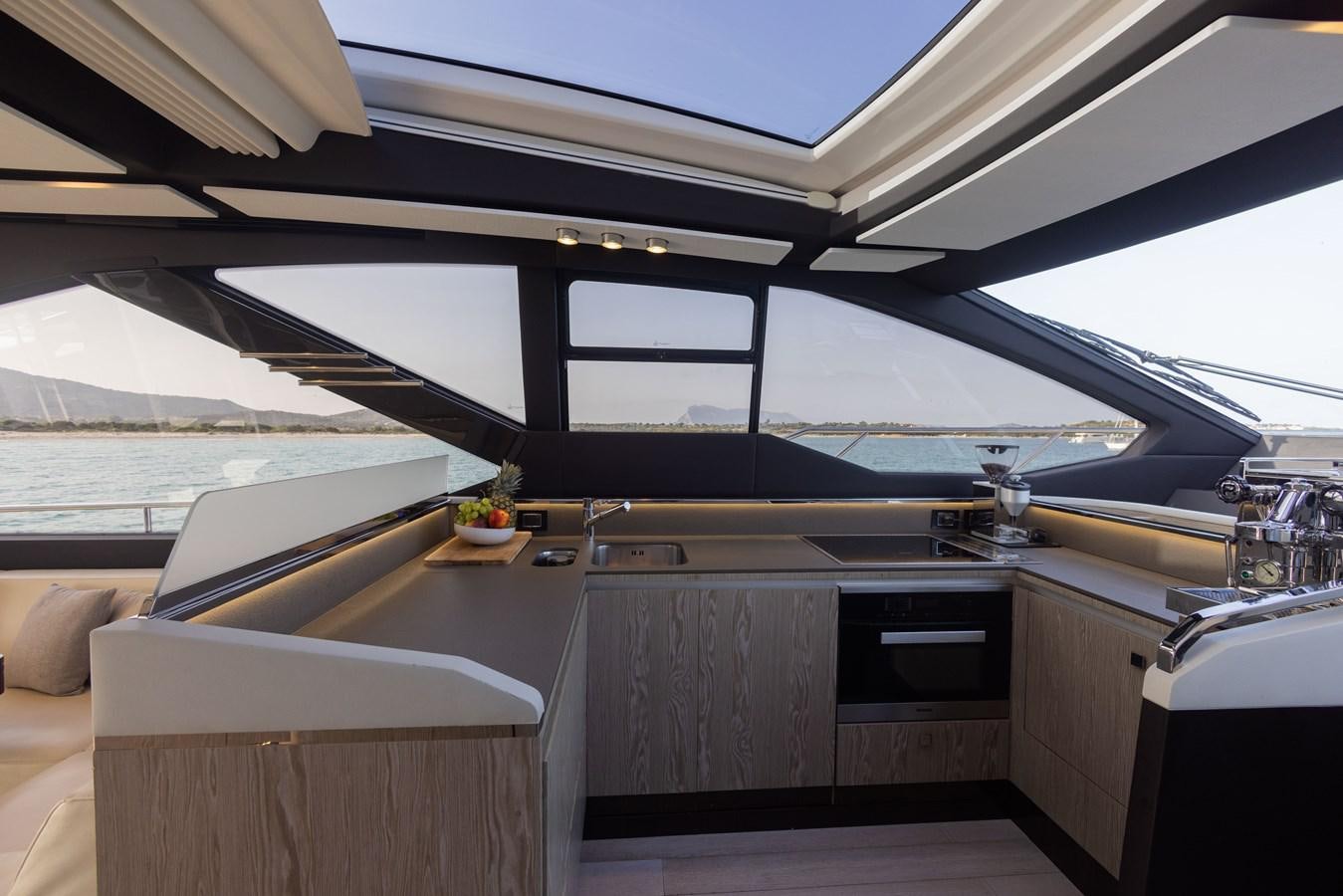 a room with a large window and a view of the ocean aboard ESCAPE Yacht for Sale