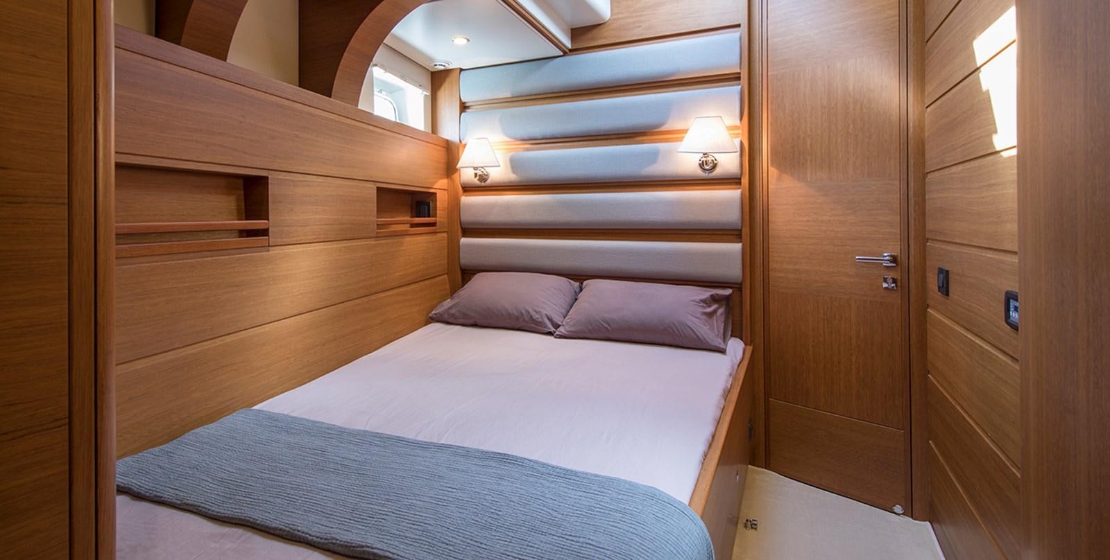 a bed in a room aboard VAYU Yacht for Sale