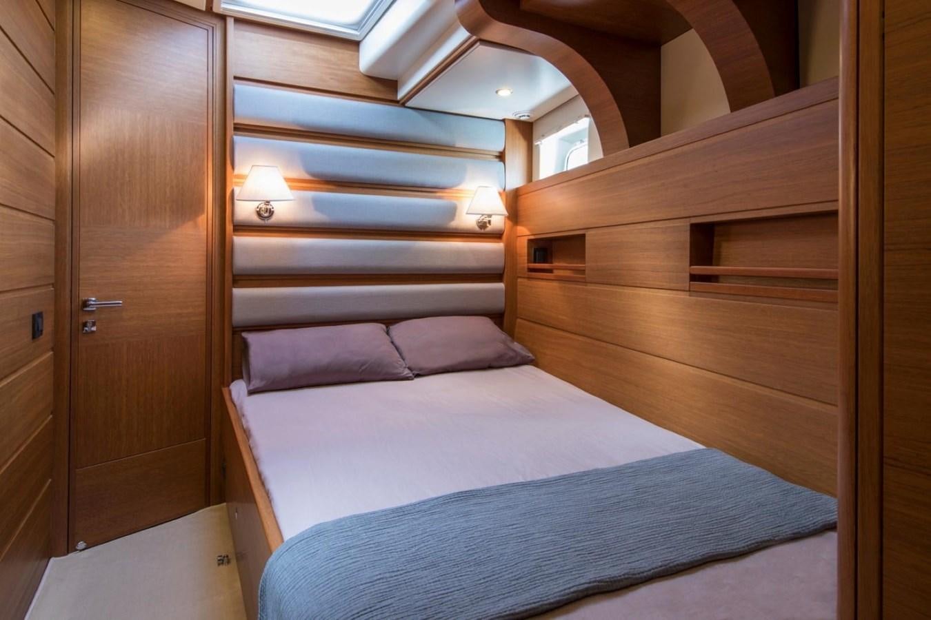 a bed in a room aboard VAYU Yacht for Sale