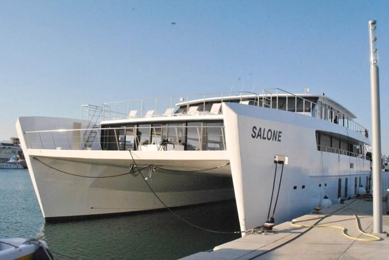 a boat docked at a pier aboard SALONE Yacht for Sale