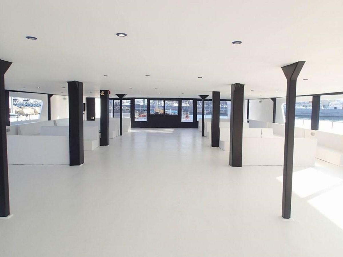 a room with a large window and a view of the water aboard SALONE Yacht for Sale