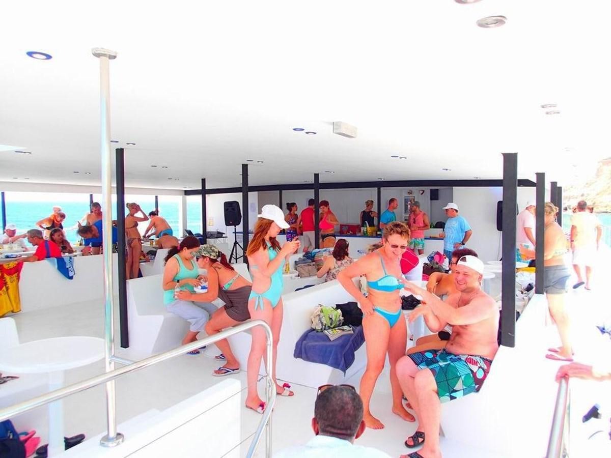 a group of people on a boat aboard SALONE Yacht for Sale