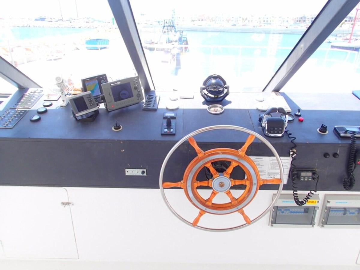 a computer desk with a computer and a monitor on it aboard SALONE Yacht for Sale