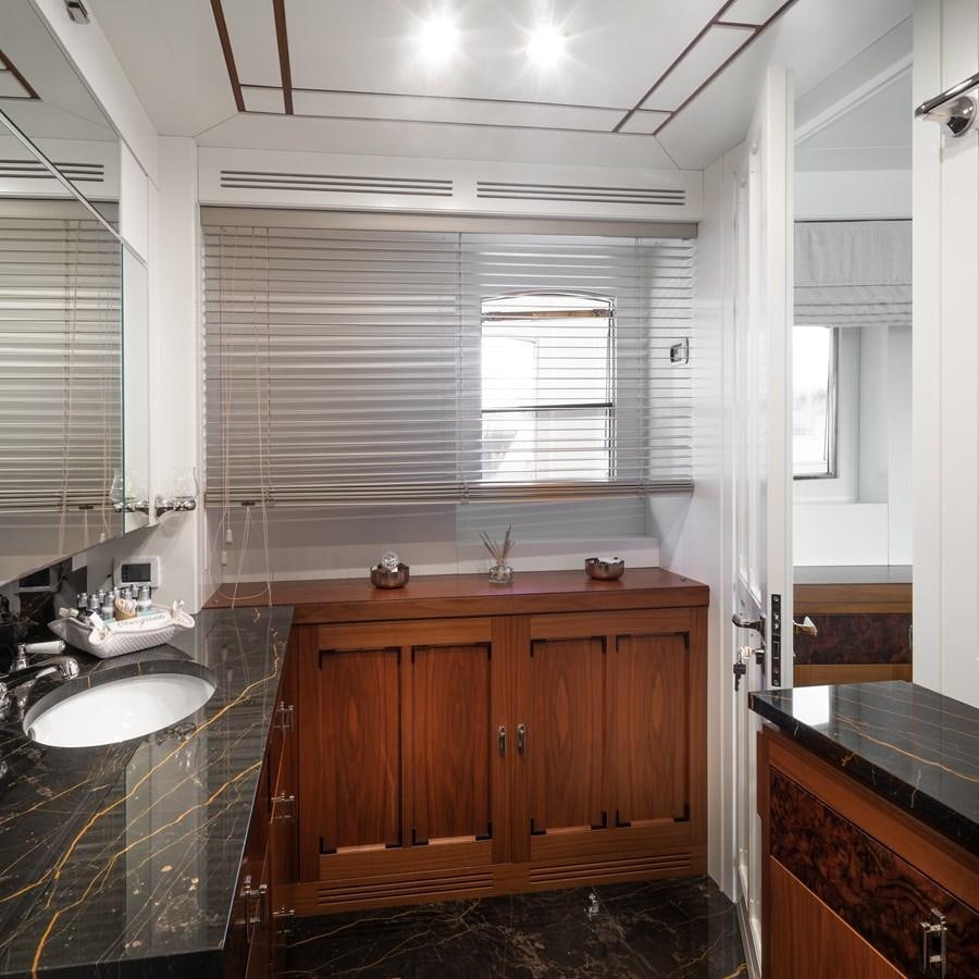 a bathroom with a sink and a mirror aboard EVERGREEN G Yacht for Sale