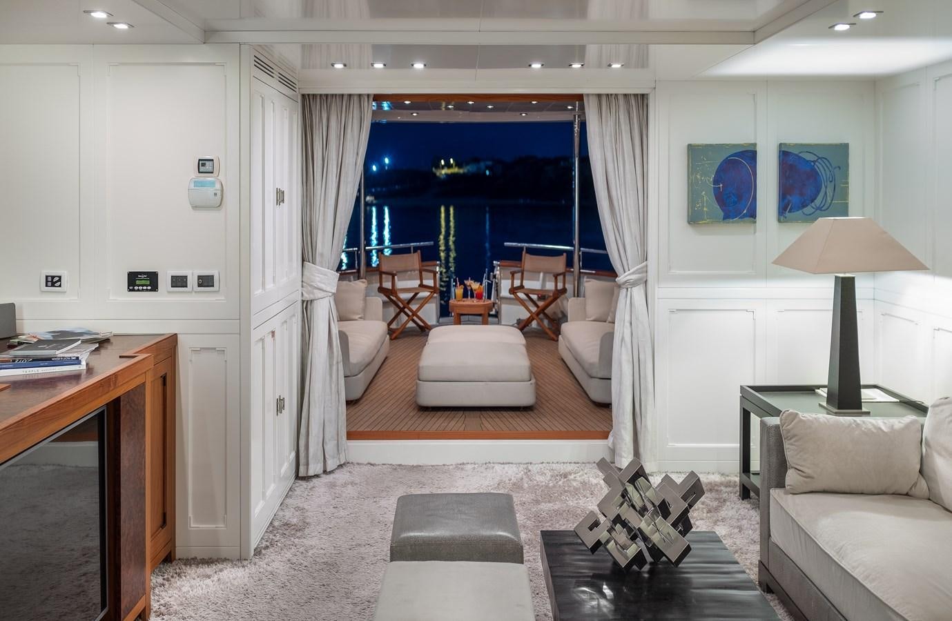 a living room with a large window aboard EVERGREEN G Yacht for Sale