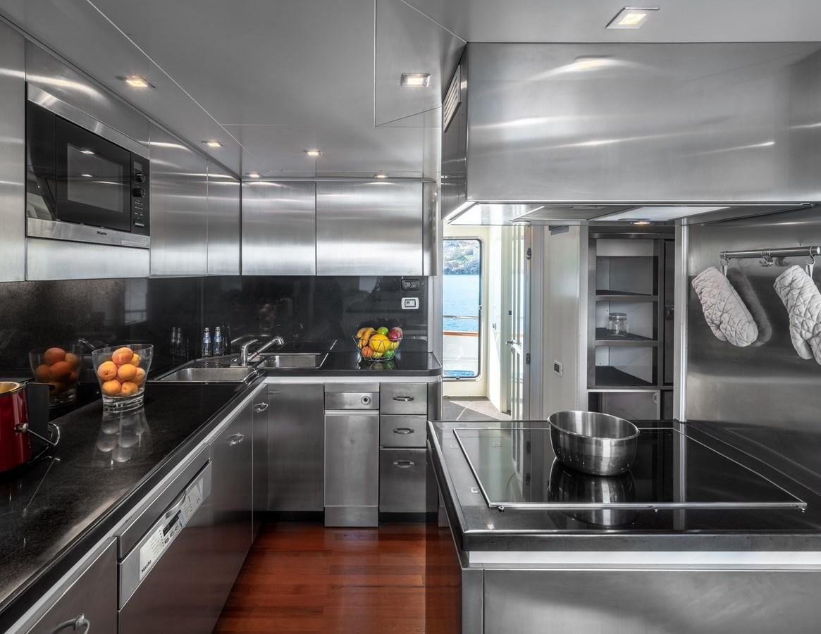 a modern kitchen with stainless steel appliances aboard EVERGREEN G Yacht for Sale