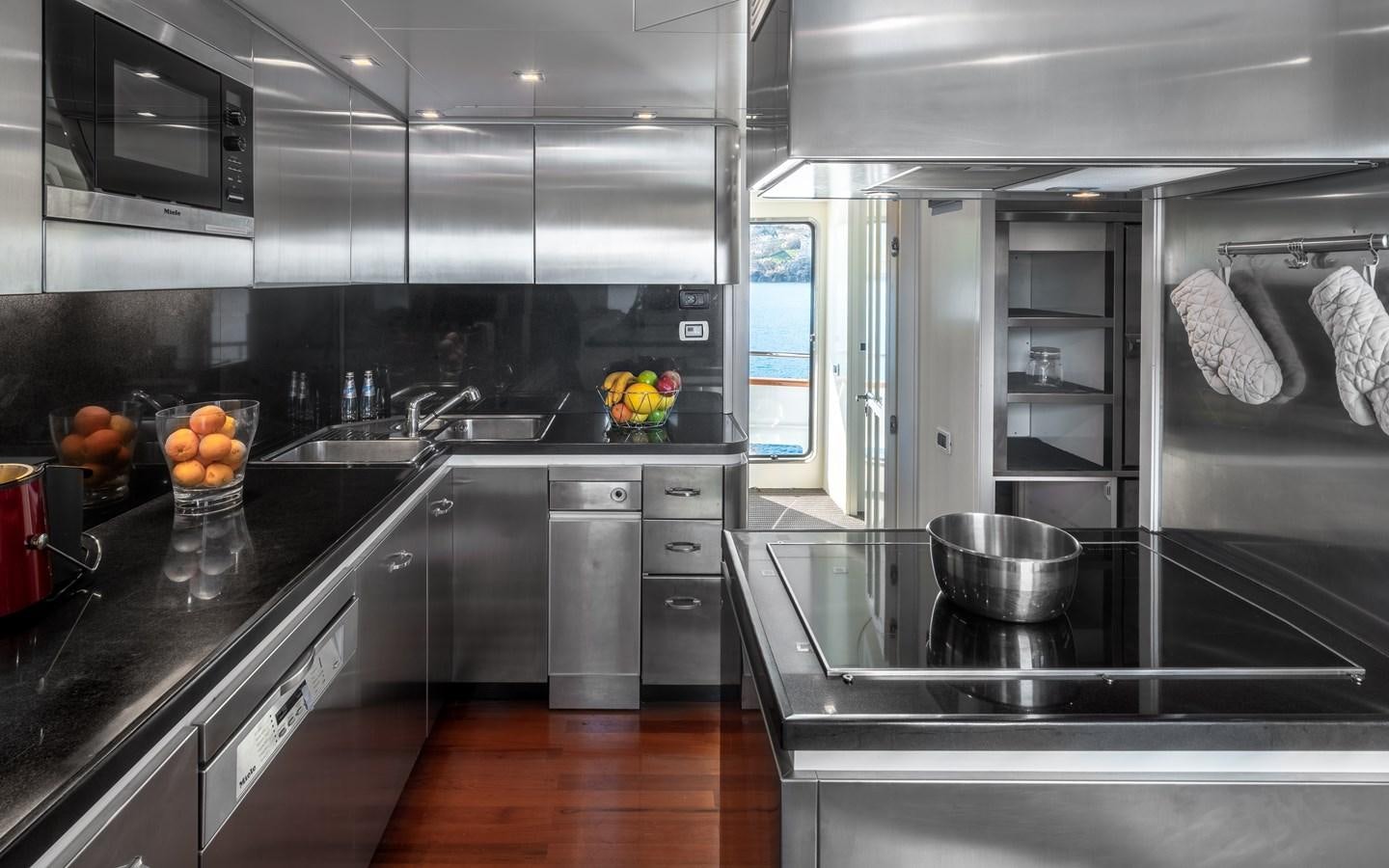 a kitchen with a sink and a stove aboard EVERGREEN G Yacht for Sale