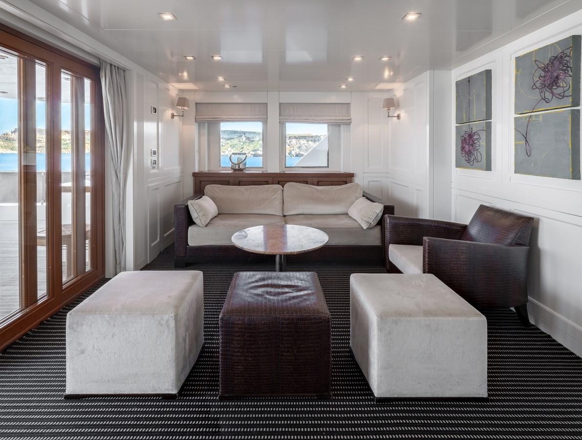 a living room with a couch and a table aboard EVERGREEN G Yacht for Sale