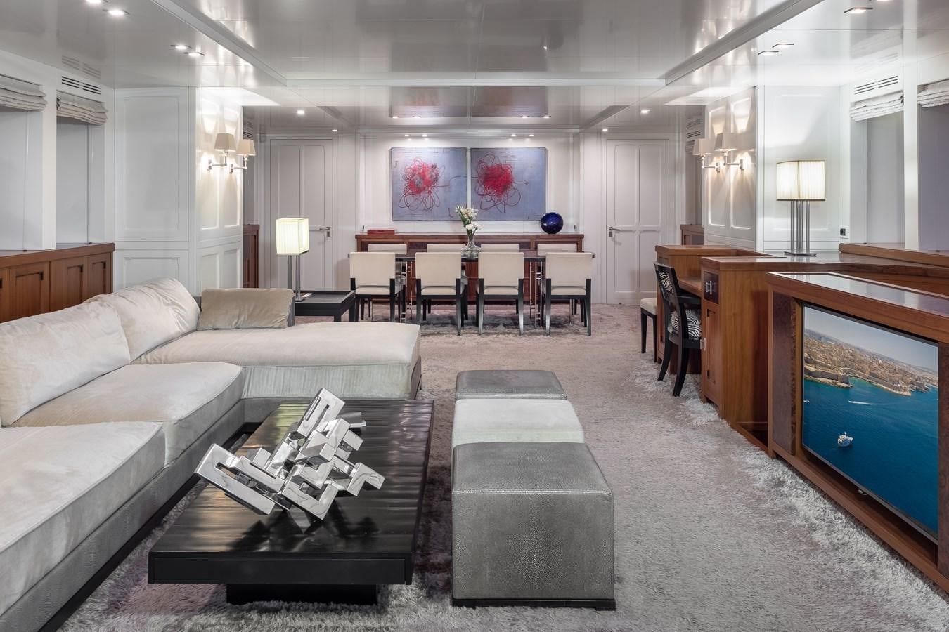 a large living room with a large mirror aboard EVERGREEN G Yacht for Sale