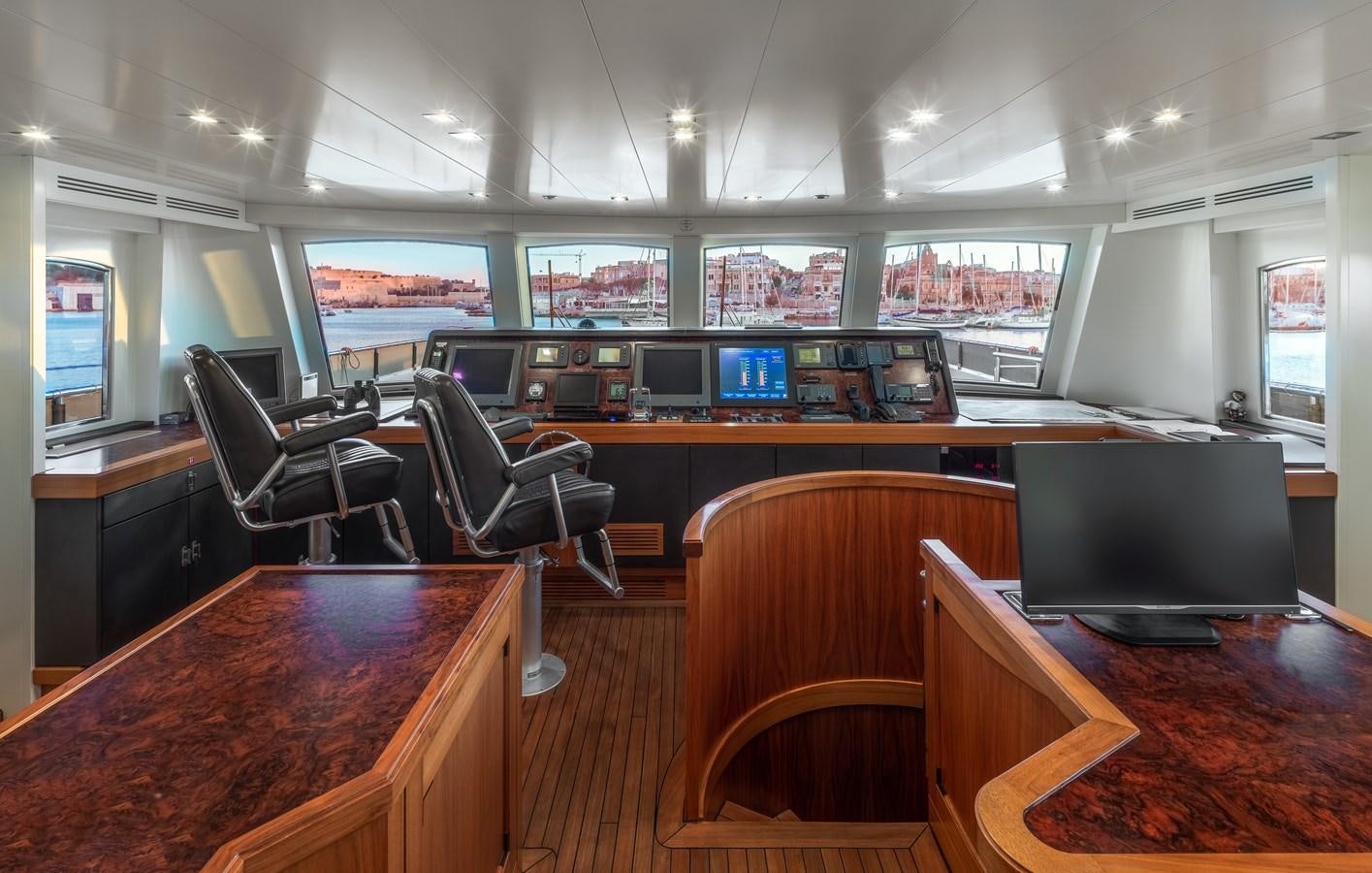 a room with a table and chairs aboard EVERGREEN G Yacht for Sale