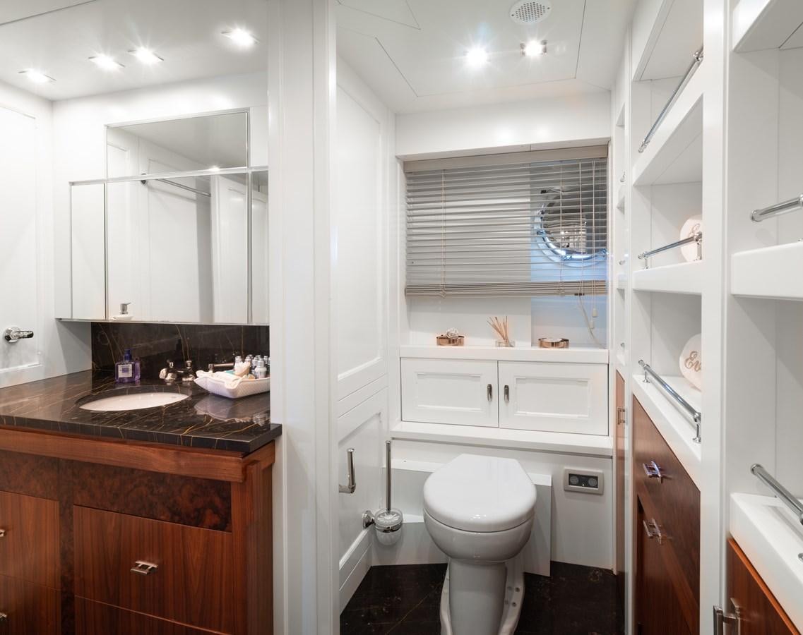 a bathroom with a toilet and a sink aboard EVERGREEN G Yacht for Sale
