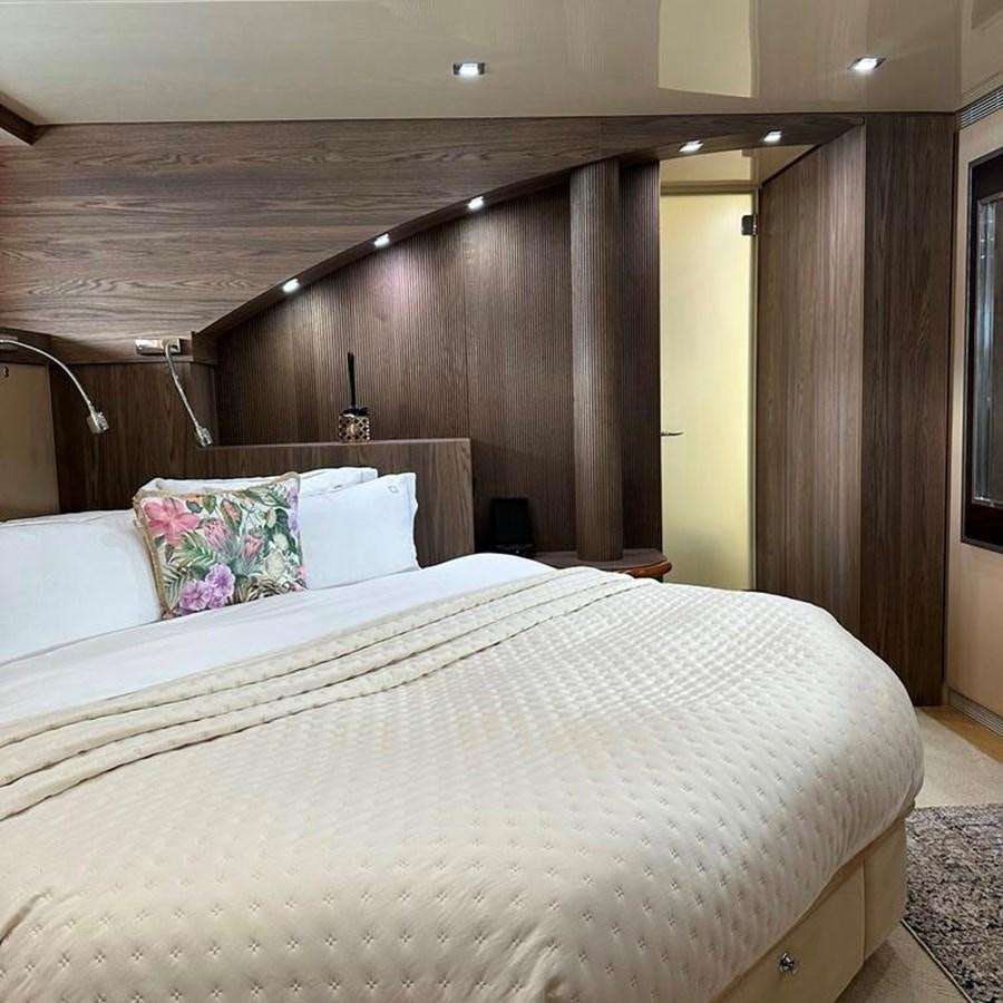 a bed with a white sheet aboard DALOLI Yacht for Sale