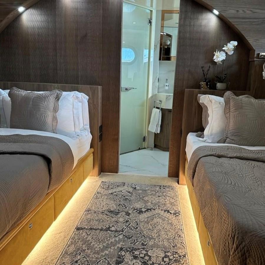 a room with a bed and a mirror aboard DALOLI Yacht for Sale