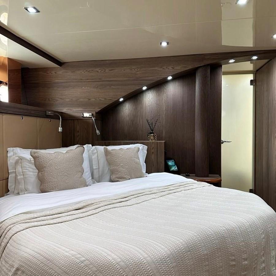 a bed with a white sheet aboard DALOLI Yacht for Sale