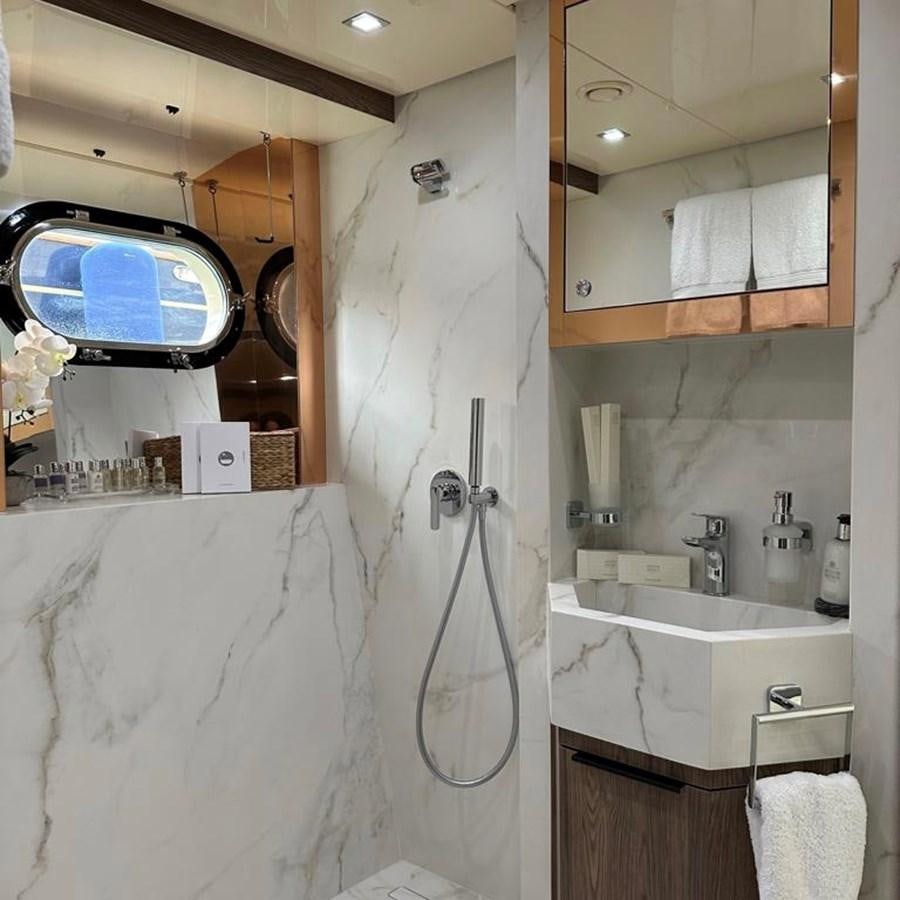 a bathroom with a sink and a mirror aboard DALOLI Yacht for Sale