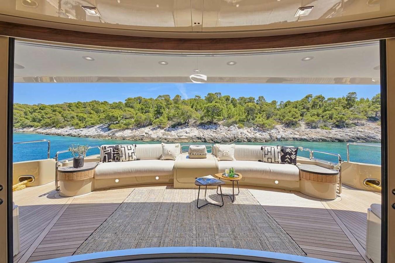 a patio with a large window overlooking a body of water aboard DALOLI Yacht for Sale