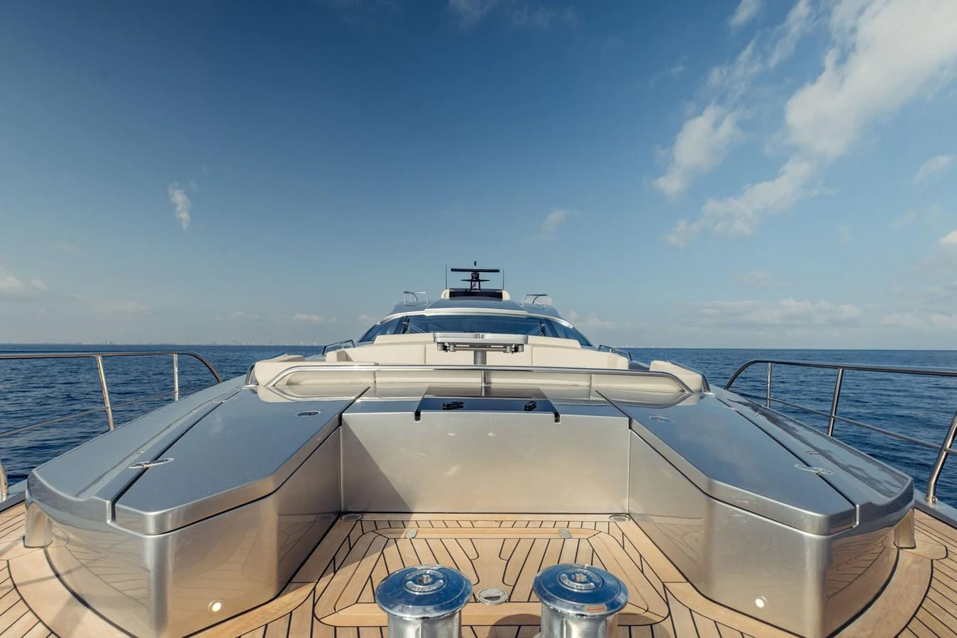 a white boat on a dock aboard STALLION Yacht for Sale