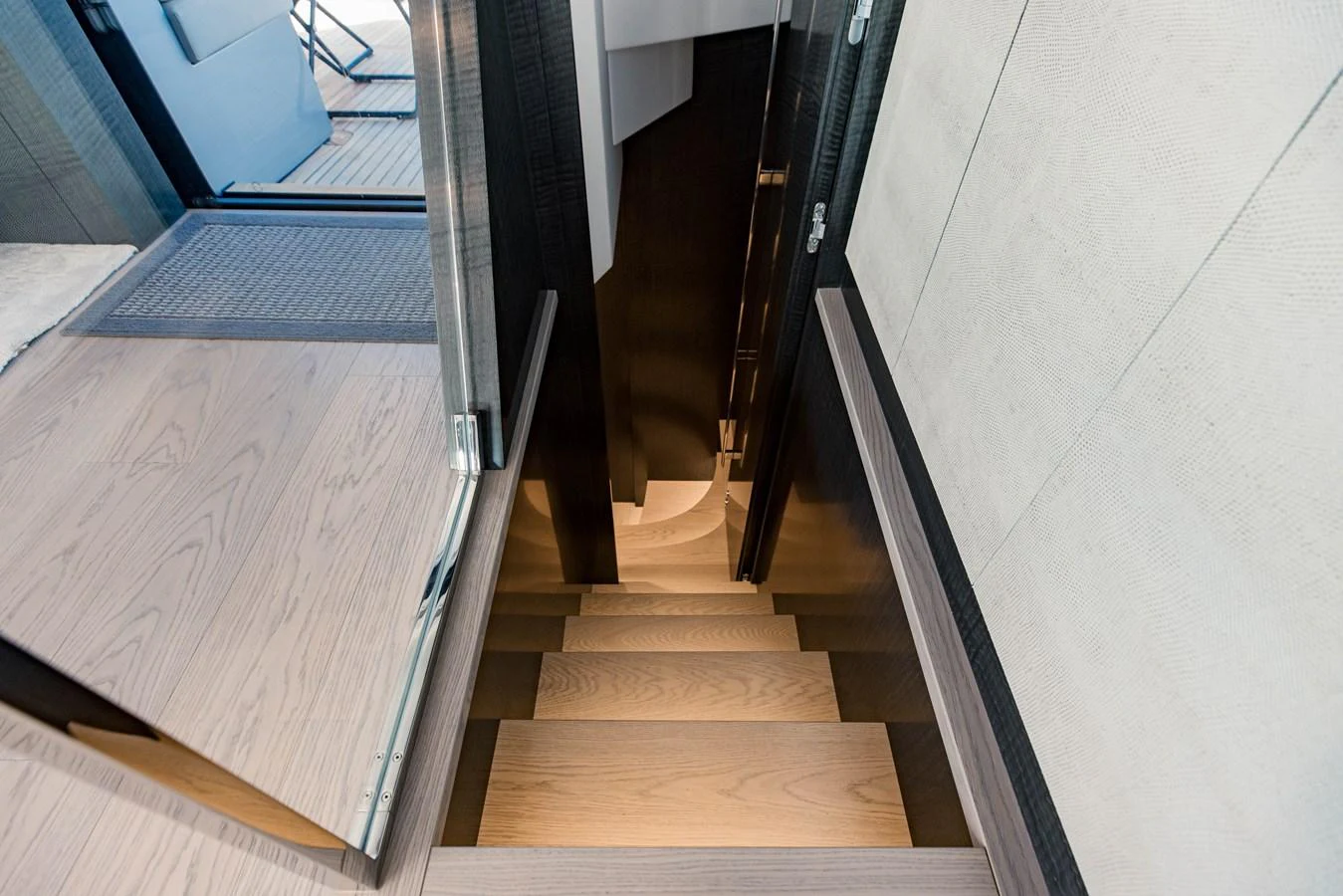 a wooden staircase with a wood floor aboard STALLION Yacht for Sale