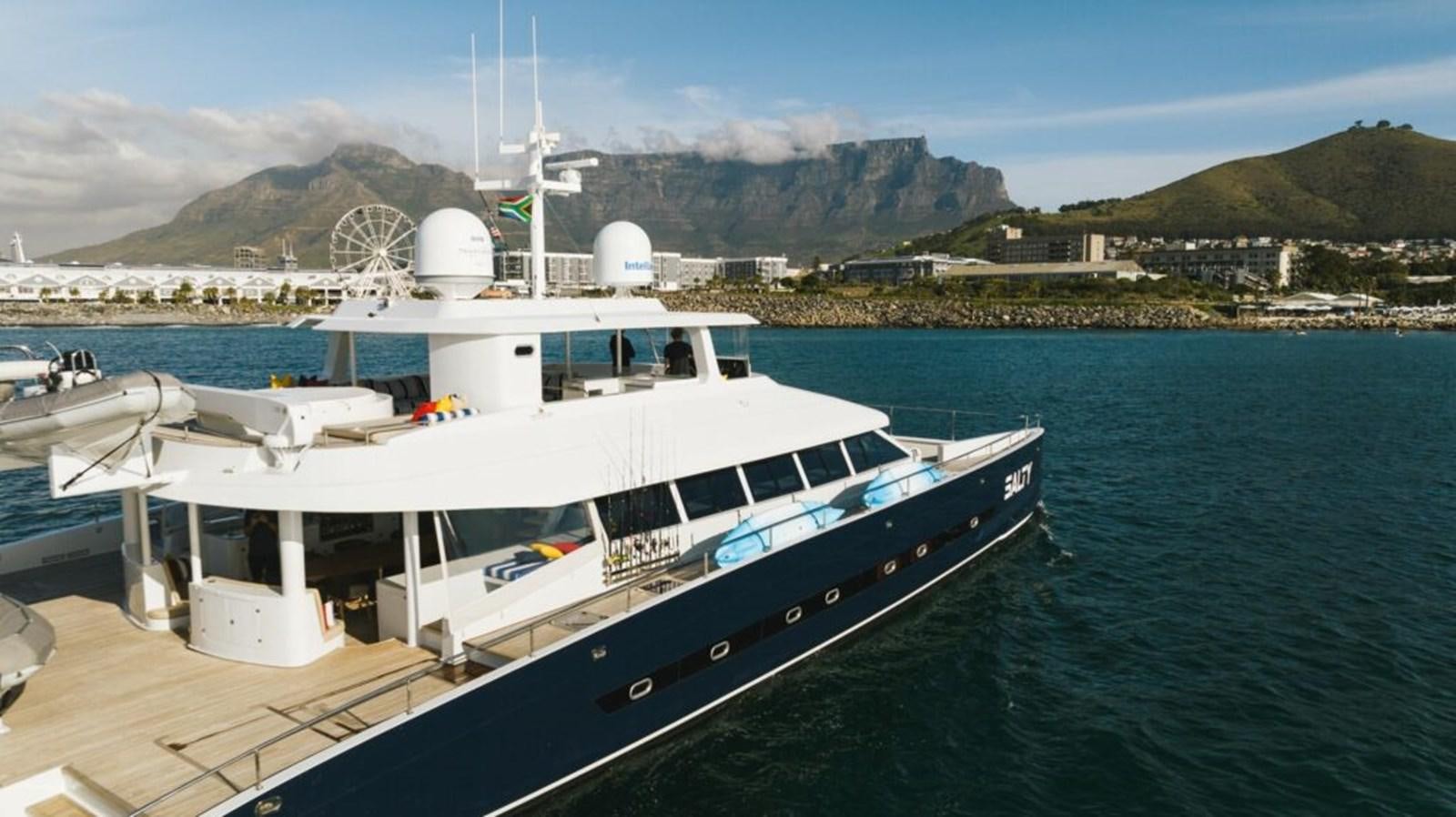 a boat docked at a pier aboard SALTY Yacht for Sale