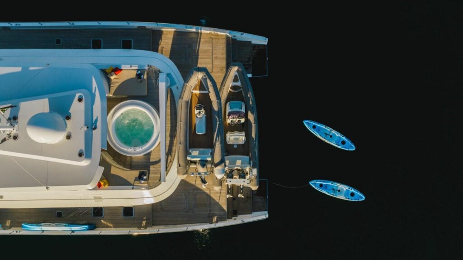 a group of cars parked in a parking lot aboard SALTY Yacht for Sale