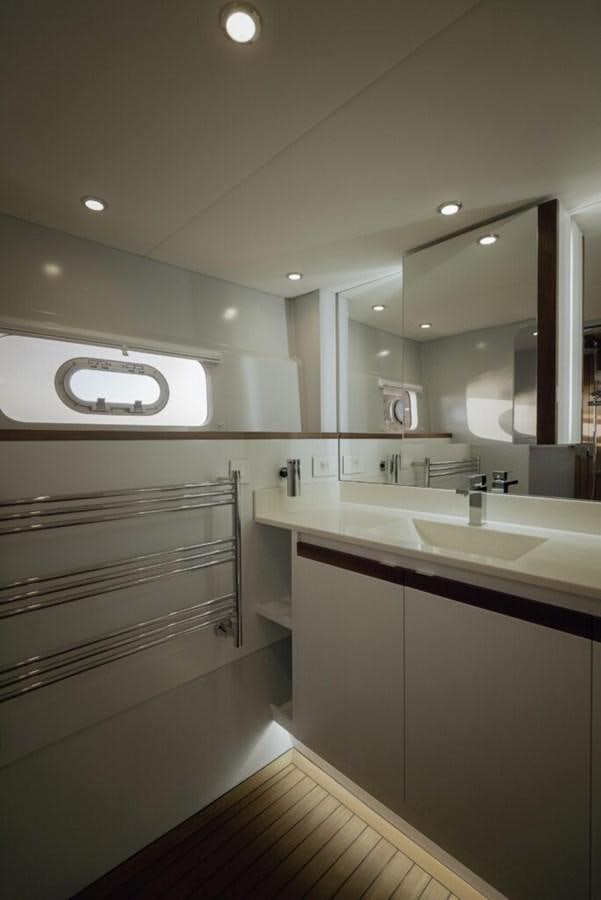 a bathroom with a large mirror aboard SALTY Yacht for Sale