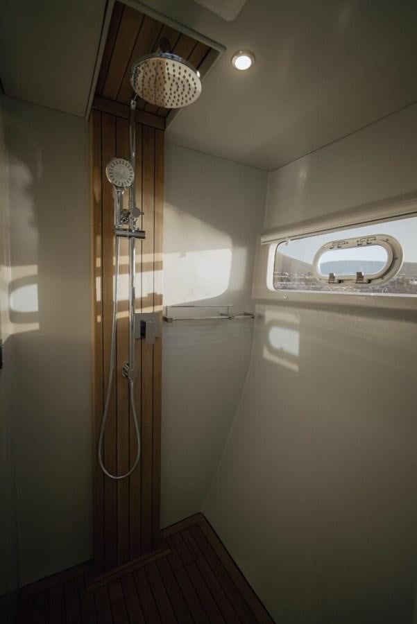 a shower with a chandelier aboard SALTY Yacht for Sale