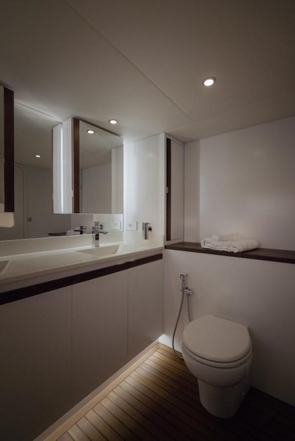 a bathroom with a toilet and a sink aboard SALTY Yacht for Sale