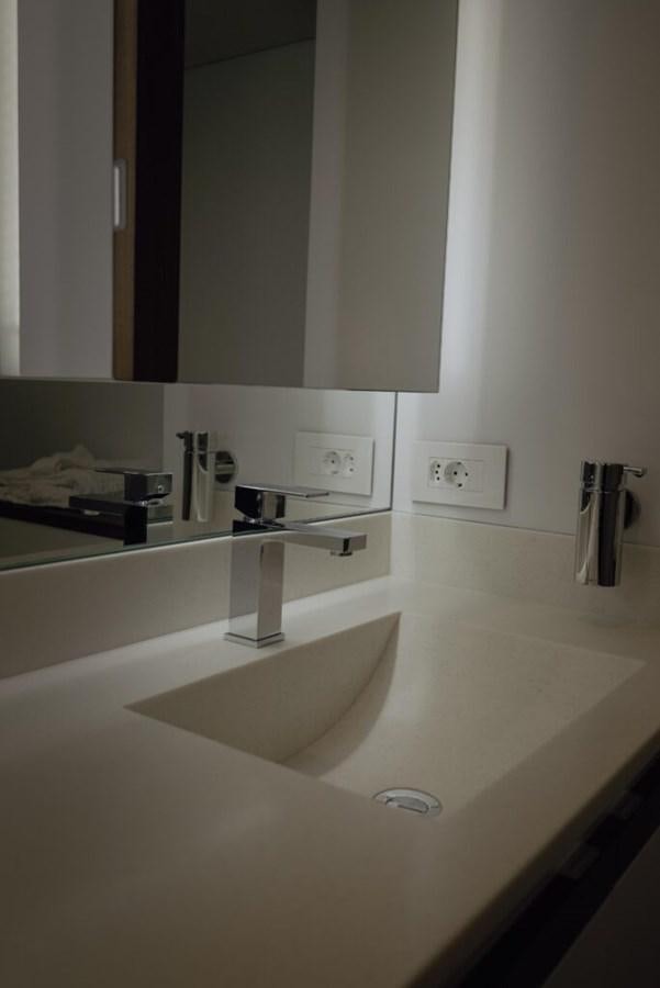 a bathroom sink with a mirror above it aboard SALTY Yacht for Sale