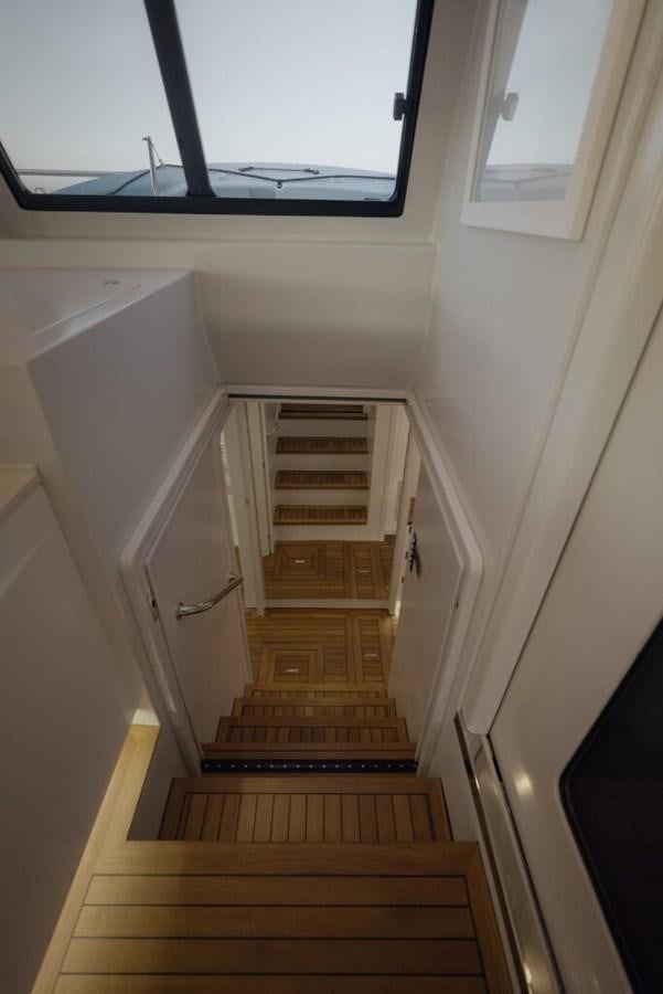 a wooden staircase in a room aboard SALTY Yacht for Sale