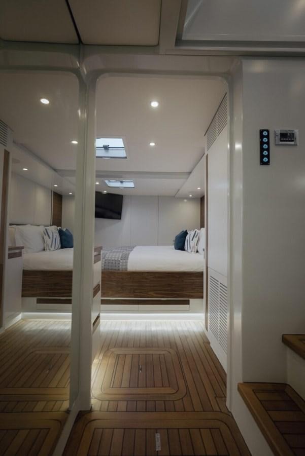 a room with a bed and a desk aboard SALTY Yacht for Sale