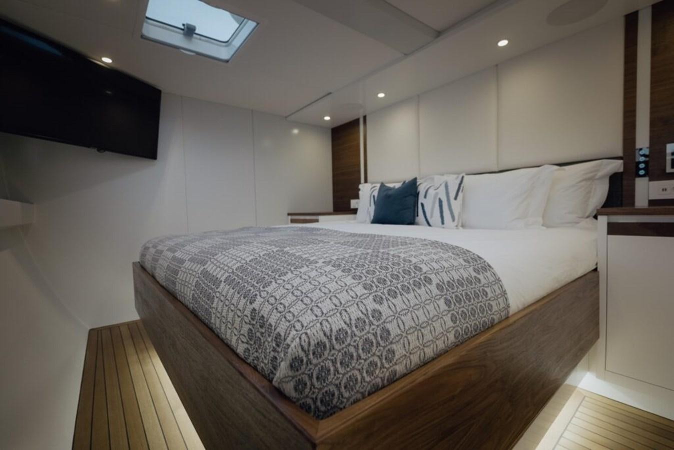 a large bed in a room aboard SALTY Yacht for Sale