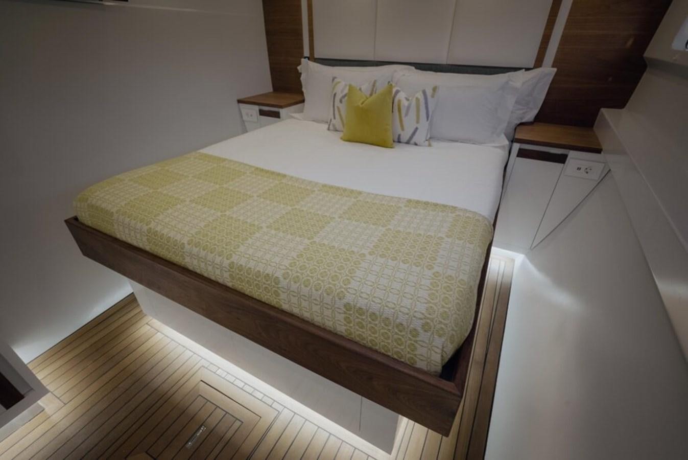 a bed with a pillow aboard SALTY Yacht for Sale