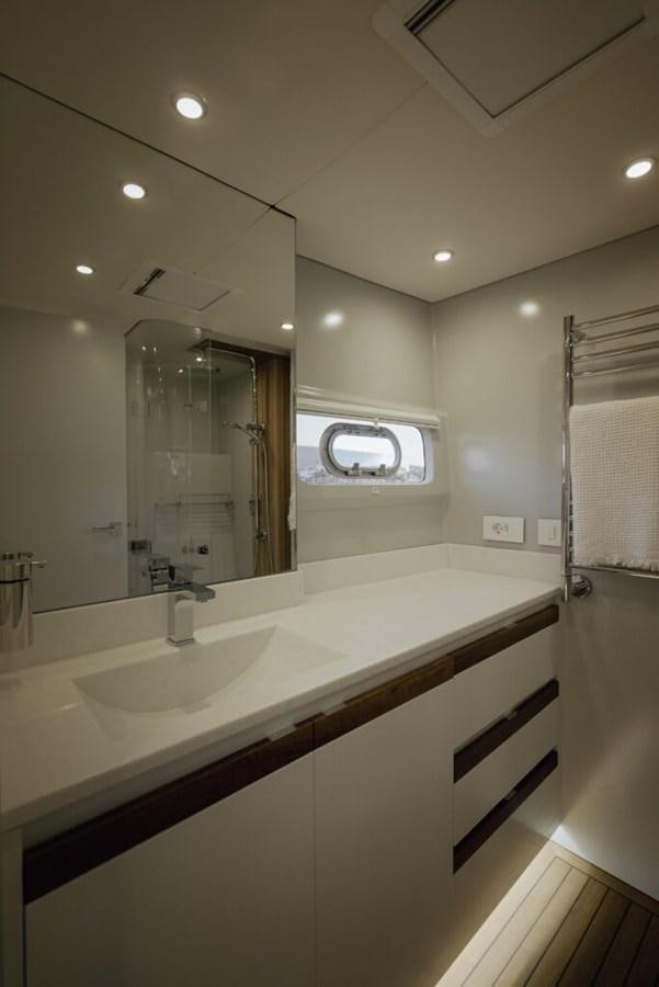 a bathroom with a large mirror aboard SALTY Yacht for Sale