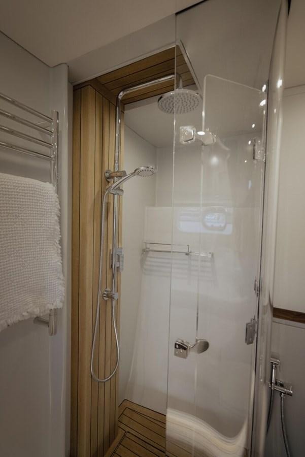 a shower with a glass door aboard SALTY Yacht for Sale