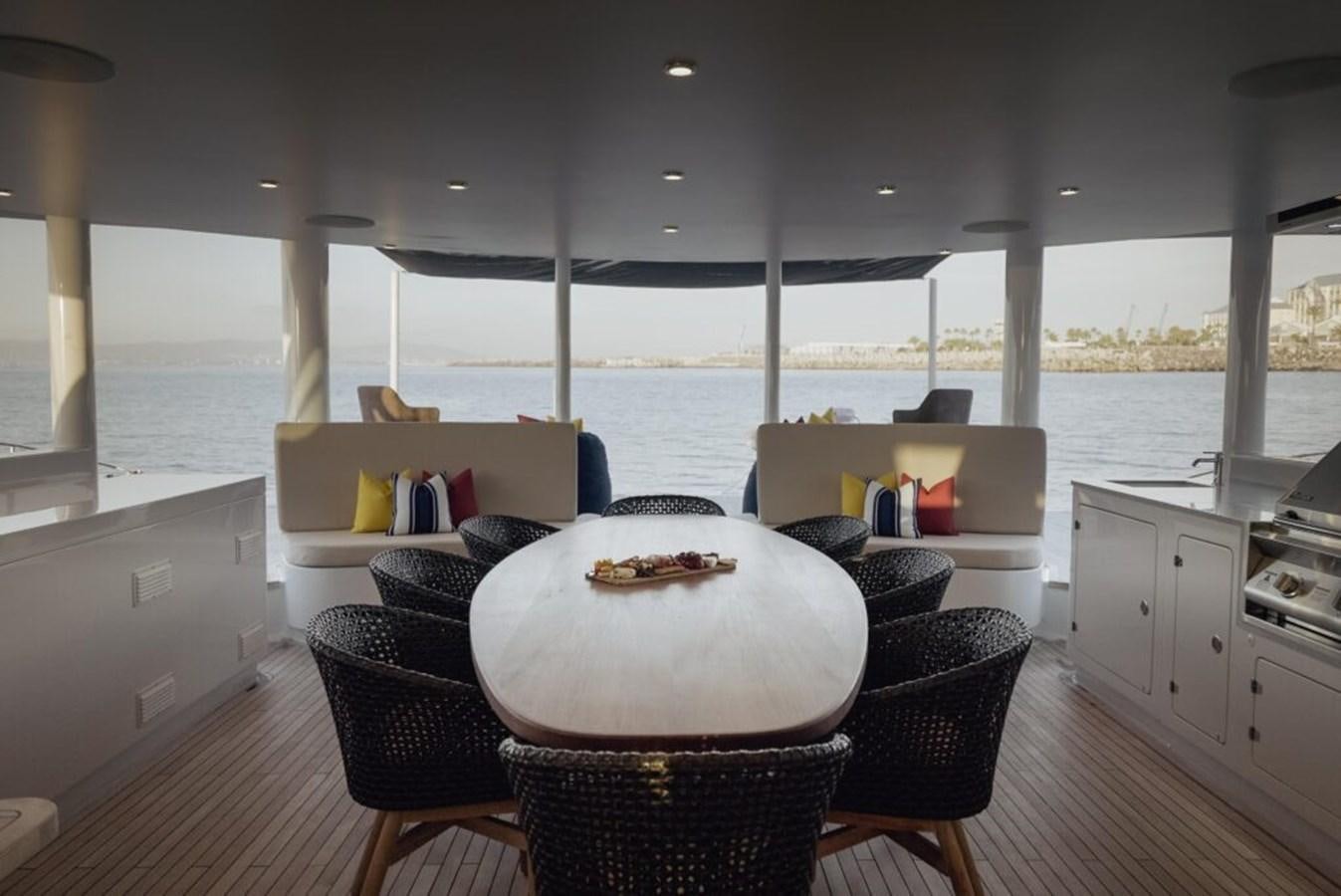 a kitchen with a table and chairs aboard SALTY Yacht for Sale