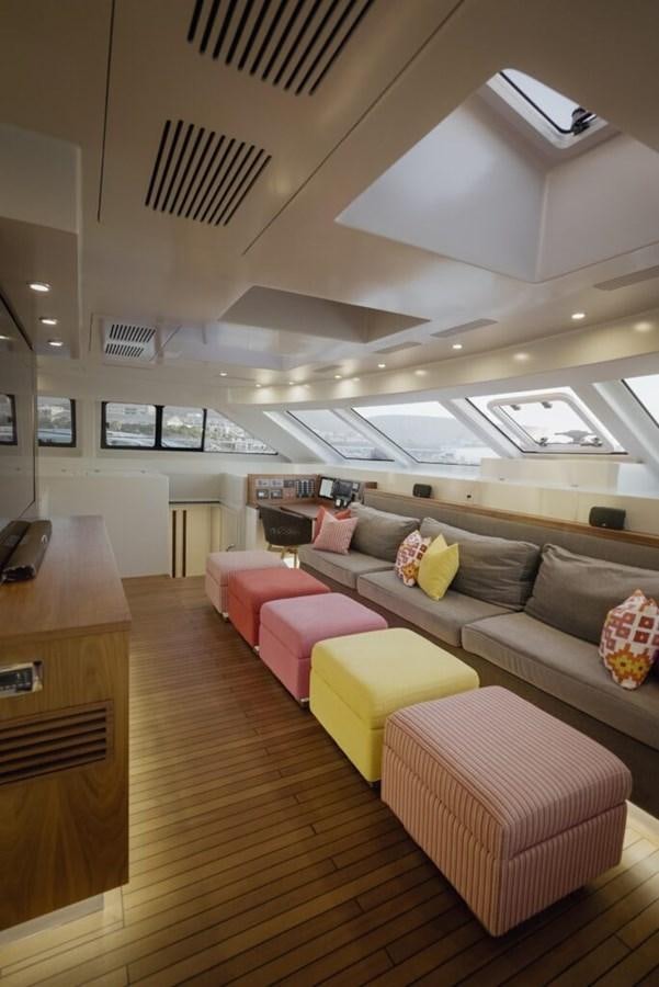 a living room with a couch and a table aboard SALTY Yacht for Sale