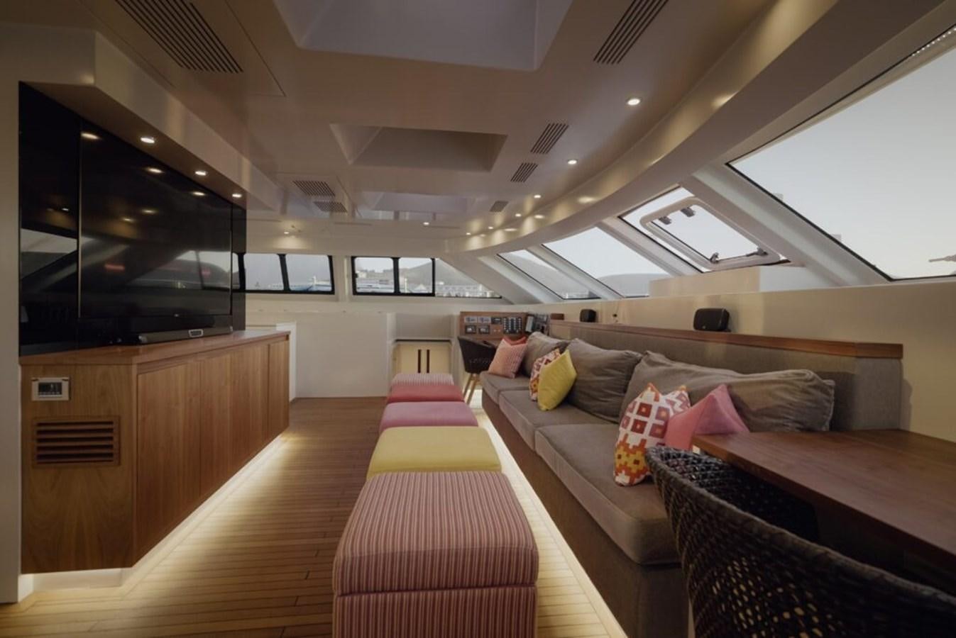a room with a couch and a bed aboard SALTY Yacht for Sale