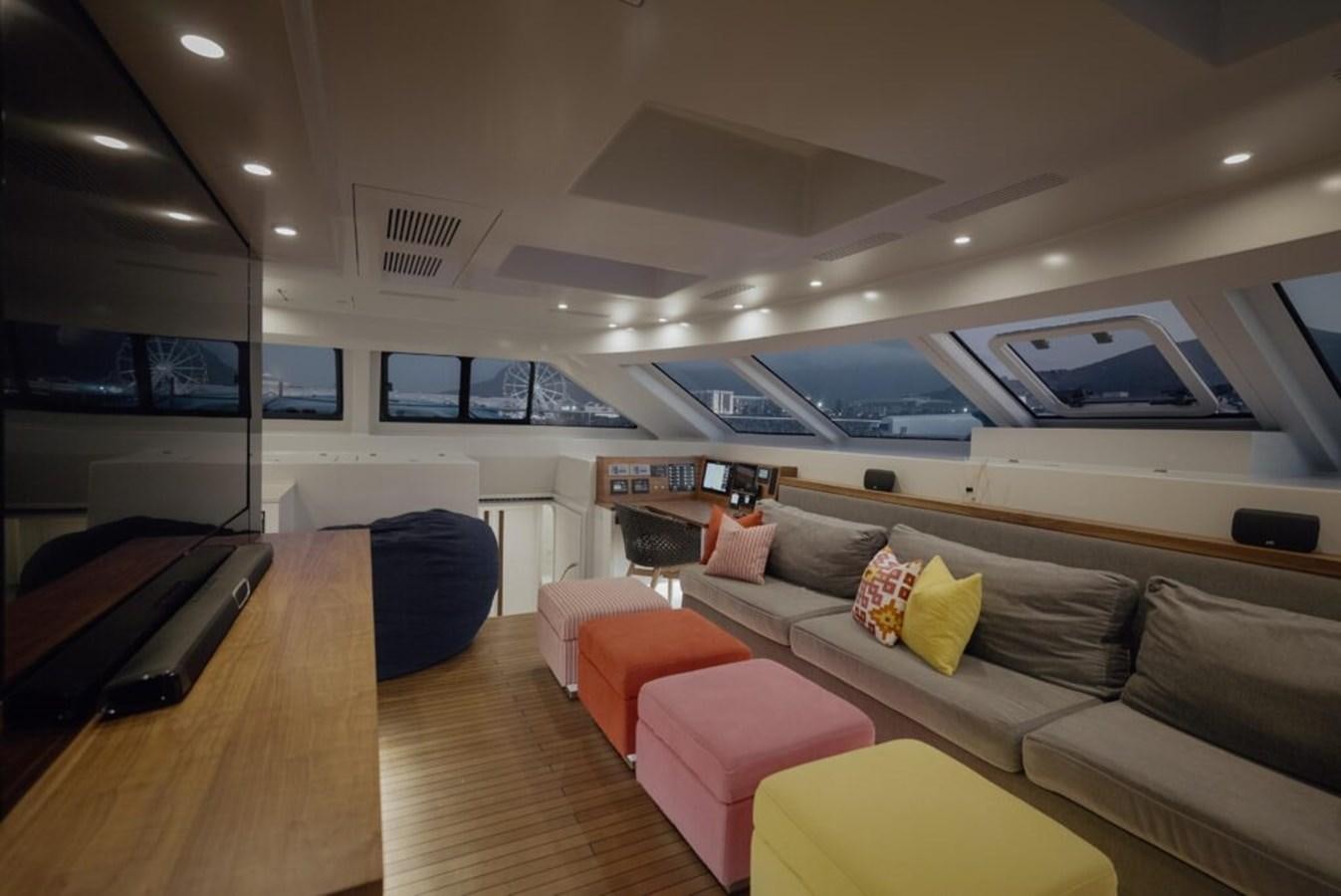 a room with a couch and a table aboard SALTY Yacht for Sale