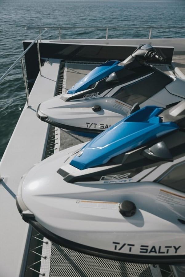 a boat with a blue and white stripe aboard SALTY Yacht for Sale