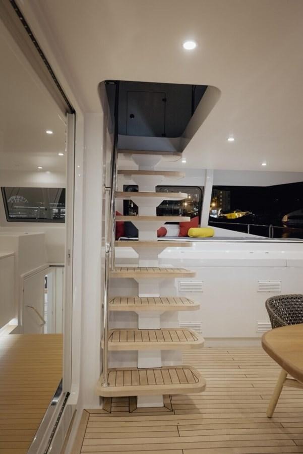 a kitchen with a large refrigerator aboard SALTY Yacht for Sale